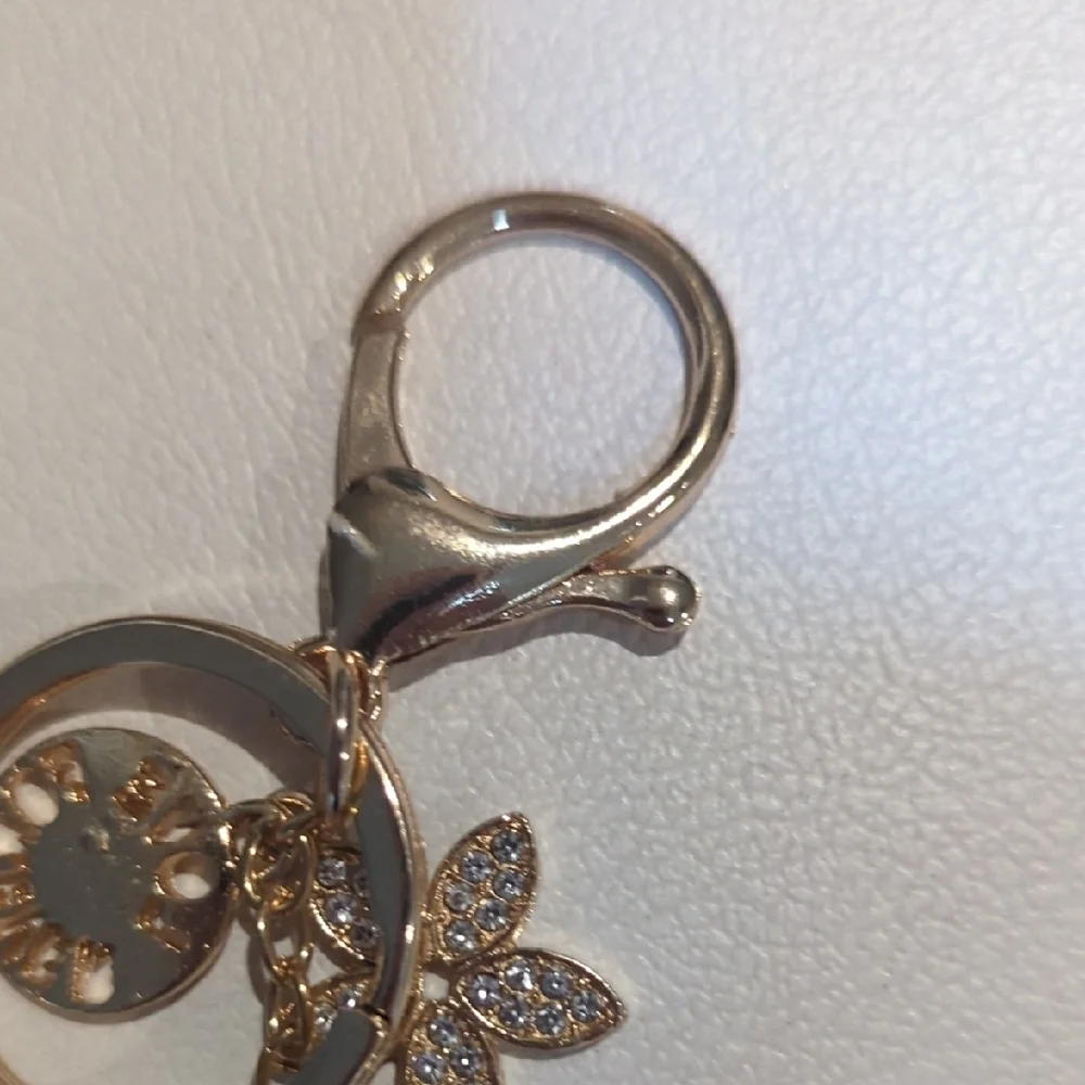 Elegant Gold Keychain with Floral Charm